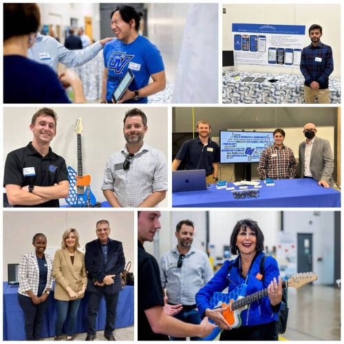 Event attendees stand in front of tables displaying tech projects and posters, engaging in friendly presentations at a college tech expo. Smiles, interactive demos, and branded sports‑jersey shirts evoke joy